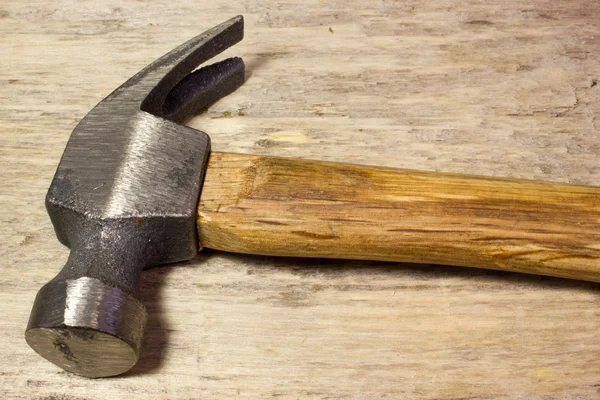 Hammer on wooden background — Stock Photo, Image