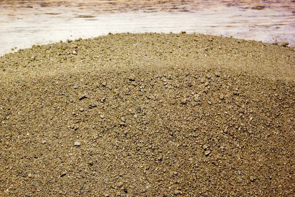 De zand textuur als achtergrond — Stockfoto