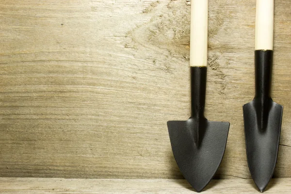 Garden tools shovel on wooden background — Stock Photo, Image
