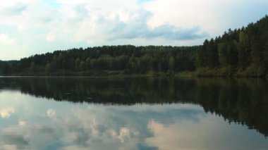 Clouds are reflected in wild lake
