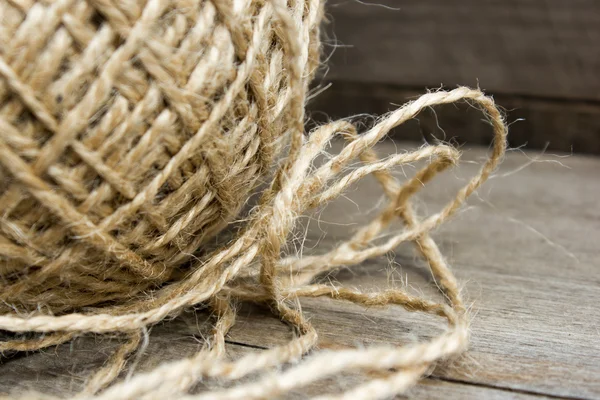 Wool ball of threads on wooden table — Stock Photo, Image