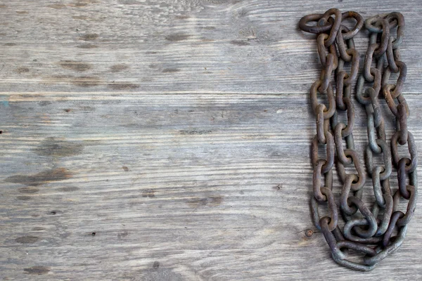 Metal chain on nice old wooden background, Copy space to right. — Stock Photo, Image