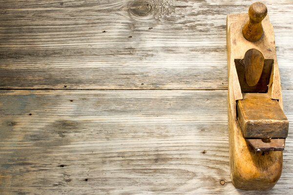 Old wooden jointers on the wood table with grunge texture