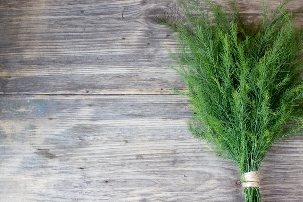 Dill on wooden table with copy space — Stock Photo, Image