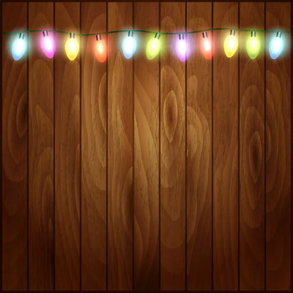 Noel Noel ışıkları ahşap dokulu arka plan.