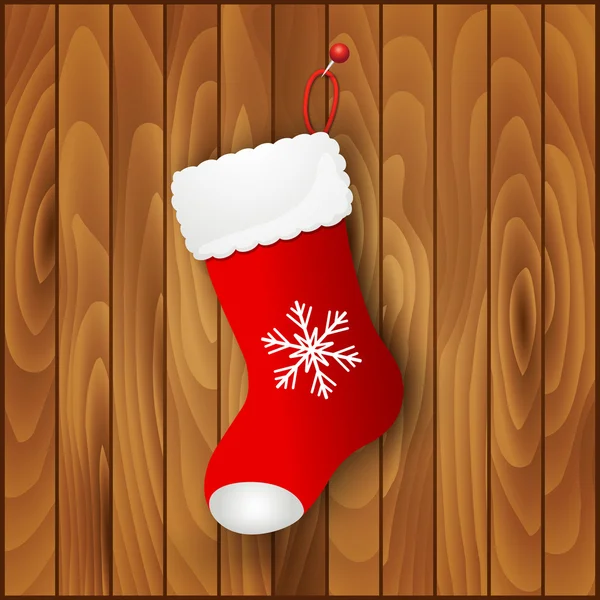 Botte Santas rouge sur fond en bois — Image vectorielle