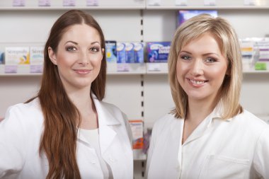 Two druggists in drugstore clipart