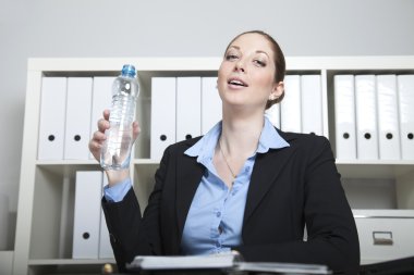 Businesswoman with water bottle clipart