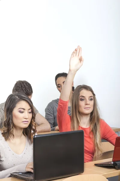 Student puts up her hand — Stock Photo, Image