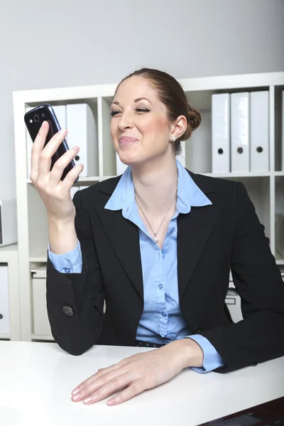 Businesswoman with smartphone — Stock Photo, Image