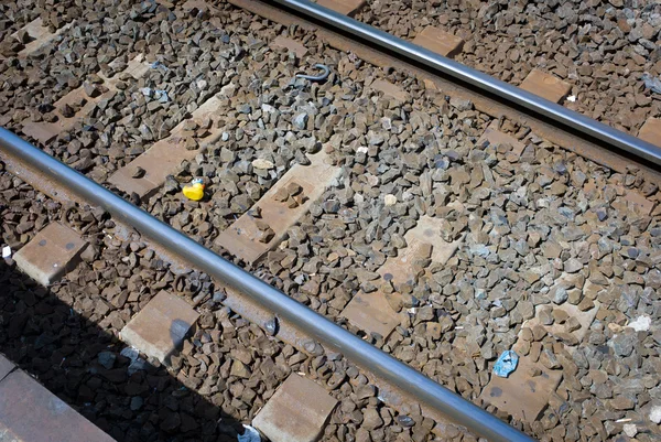 Toy abandoned on the train tracks — Stock Photo, Image