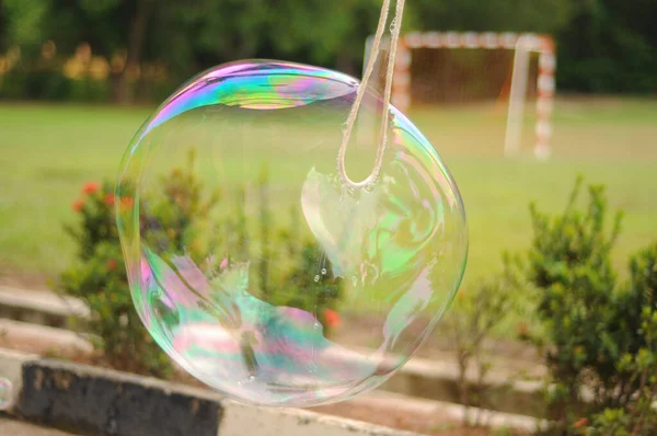 blur image of children playing giant bubble