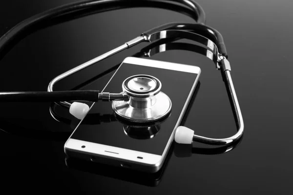 Stethoscope Και Smartphone Μαύρο Φόντο Εικόνα Αρχείου