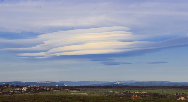 Lenticular clouds over the mountains of Crimea. Ukraine.