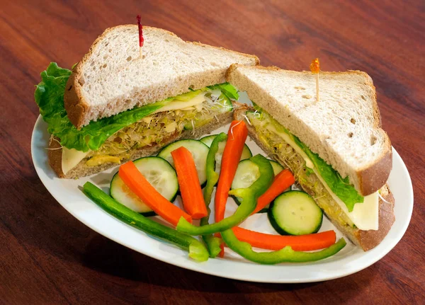Overstuffed Veggie Sandwich on White Plate