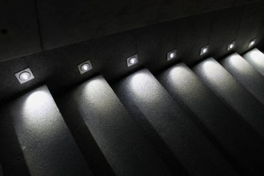 Illuminated gray concrete steps for better visibility clipart
