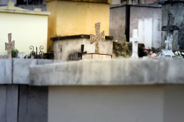 indoor scene of a cemetery showing several graves