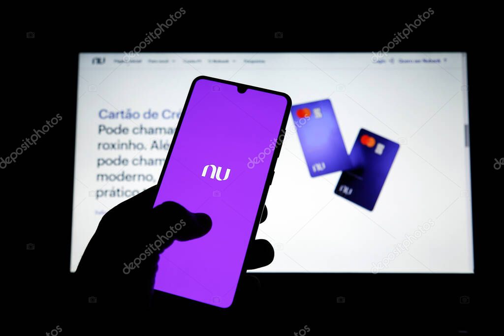 Minas Gerais, Brazil - June 02, 2021: mobile phone display and site with new Nubank brand. Digital payment system.