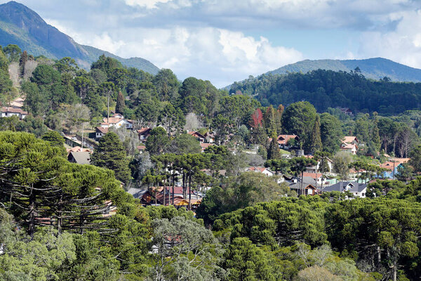 view of nature and buildings among the mountains from  Monte Verde, district of Camanducaia, interior of Minas Gerais.