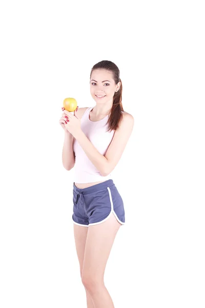 Happy young woman holding a apple and smiling — Stock Photo, Image