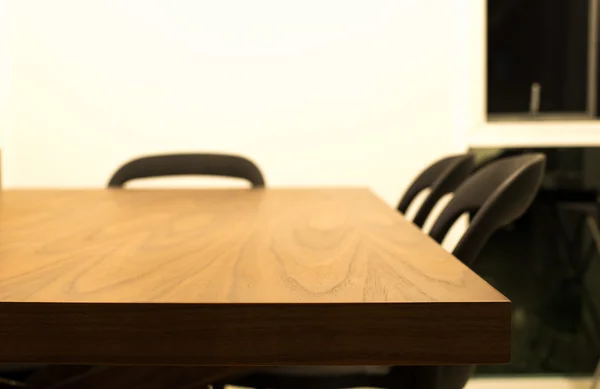 Dark brown wooden dining table with 3 chairs