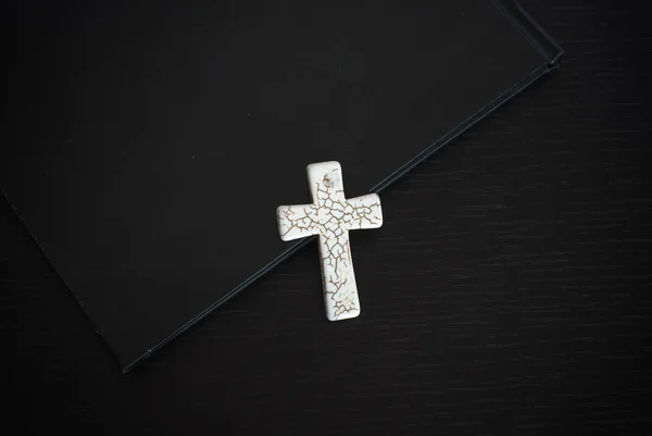 stock image Grunge white bone rosary with black bible on dark wooden table the book Easter or Christian beliefs