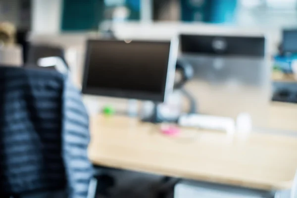 Abstract office blur background with wooden desk, chair with lap — Stock Photo, Image