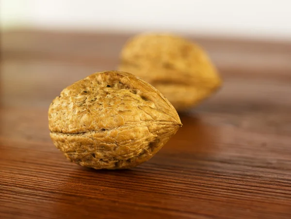 Walnuts on a wooden table. — Stock Photo, Image