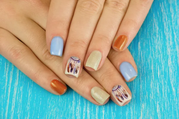 Beautiful manicure nails. Boho style. Beautiful female hands wit