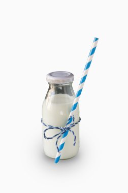 Milk bottle with striped straw isolated on white