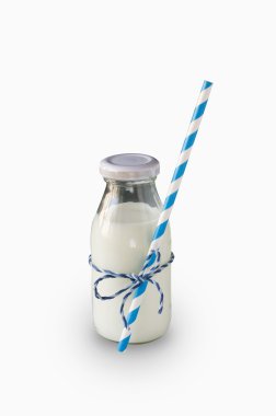 Milk bottle with striped straw isolated on white clipart