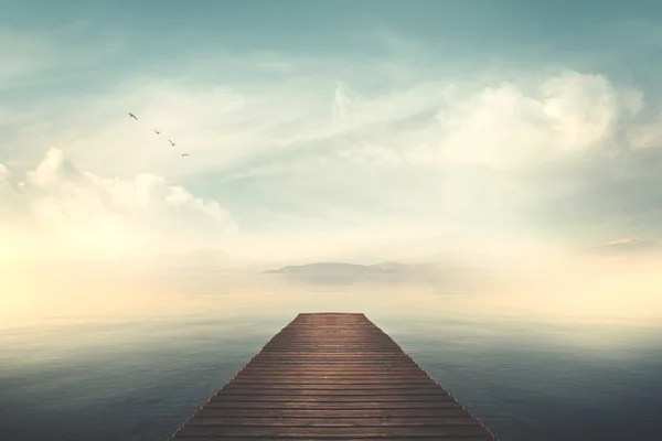 Boardwalk on the lake at sunset — Stock Photo, Image