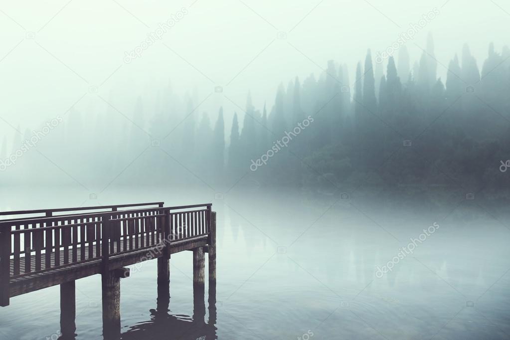 wooden boardwalk on Lake landscape in winter