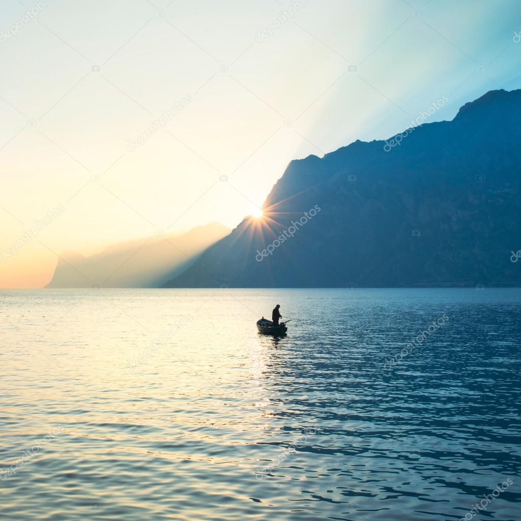 Fisherman fishing in the middle of the lake