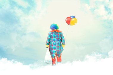 Clown with balloon lost in the clouds clipart