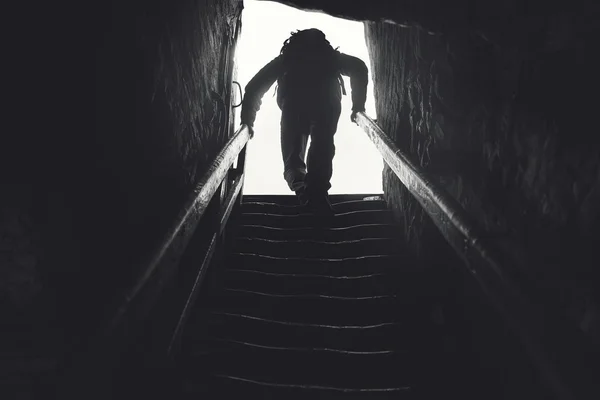 Man getting out from the darkness — Stock Photo, Image