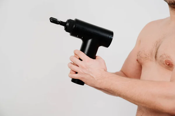 Man Holds Massage Gun Medical Sports Device Helps Reduce Muscle — Stock Photo, Image