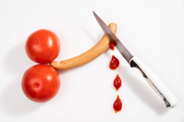 tomatoes and sausage in form of male penis on white background. Circumcision