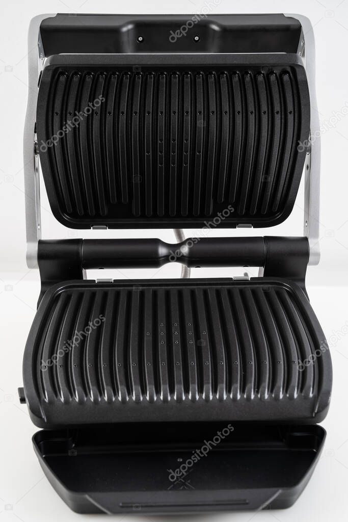 electric grill with open lid. 