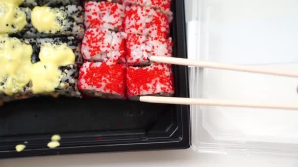 Wooden Sushi Sticks Take Roll Red Caviar Fish Rice Avocado — Stock Video