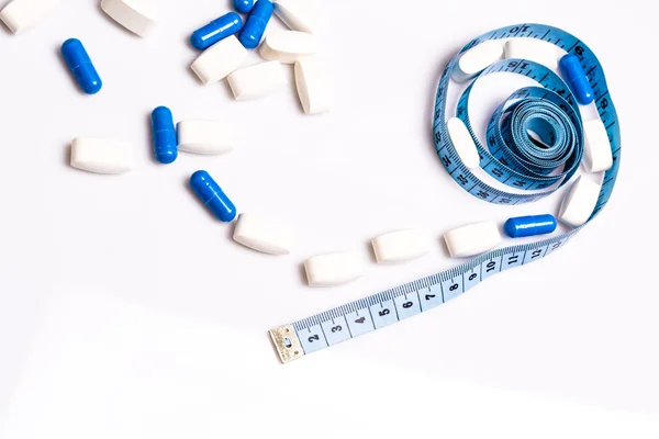 Medical pills and centimeter, for weight loss or increase penis size