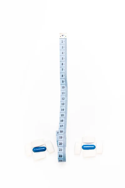 Medical pills and centimeter, for weight loss or increase penis size — Stock Photo, Image