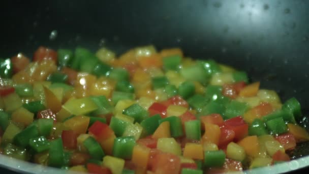 Frying bell peppers in pan — Stock Video