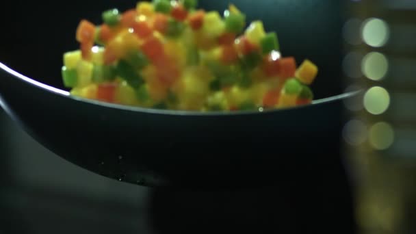 Stirring bell peppers in pan — Stock Video