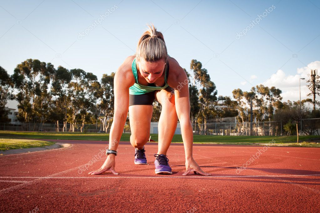 Female runner on an athletics track