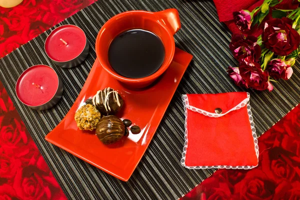 Coffee in red cup with gift envelope Stock Picture