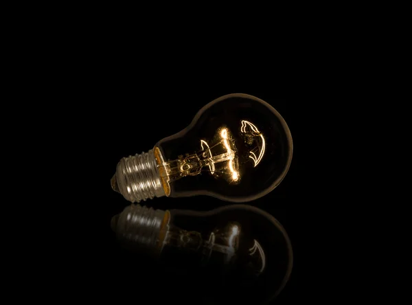 Cool lightbulb on isolated black background — Stock Photo, Image