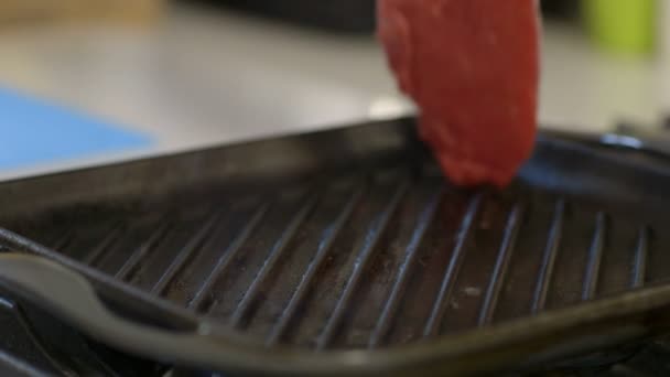 Steak placed in pan — Stock Video