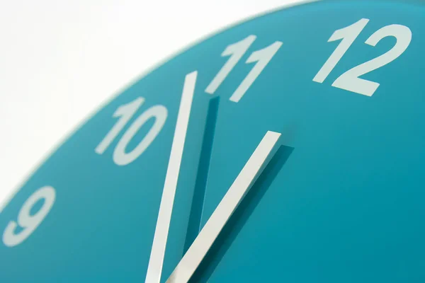 Close up of a blue green clock face — Stock Photo, Image