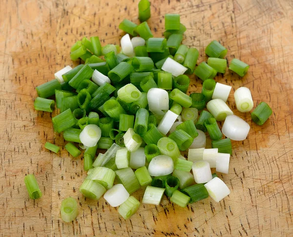 Green onion on the wooden background — Stock Photo, Image